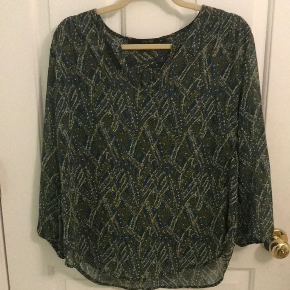 Woman’s sheer blouse. Excellent condition. Size M. 3/4 length sleeves.